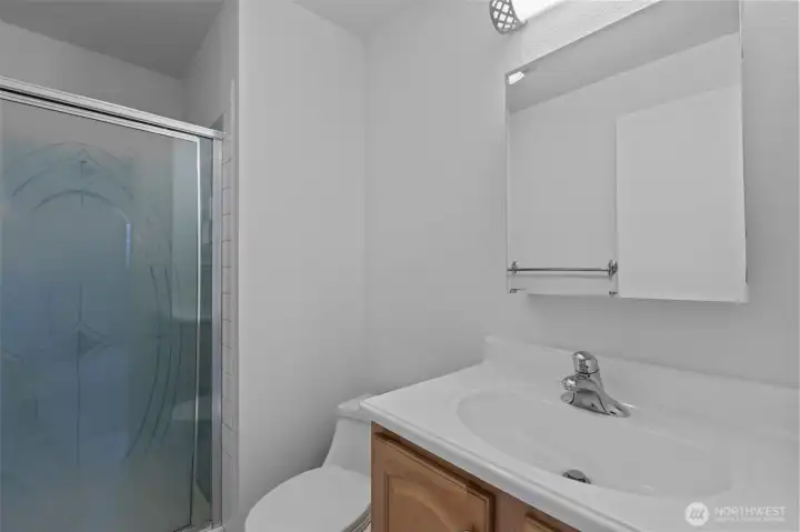3/4 Primary Bath.  I always consider that generally, buyers get confused by this.  A 1/2 Bath is more like a Powder Room where there is only a toilet and a sink, a 3/4 has a shower, and a Full has a bathtub and shower or a combination of the 2.  If you are looking for 2 places where people can shower, you want at least two-3/4 baths OR 1-3/4 (1.75 is the same thing).