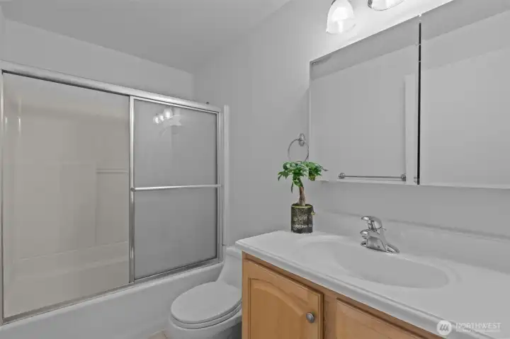 Beautiful Full Bath with glass doors.