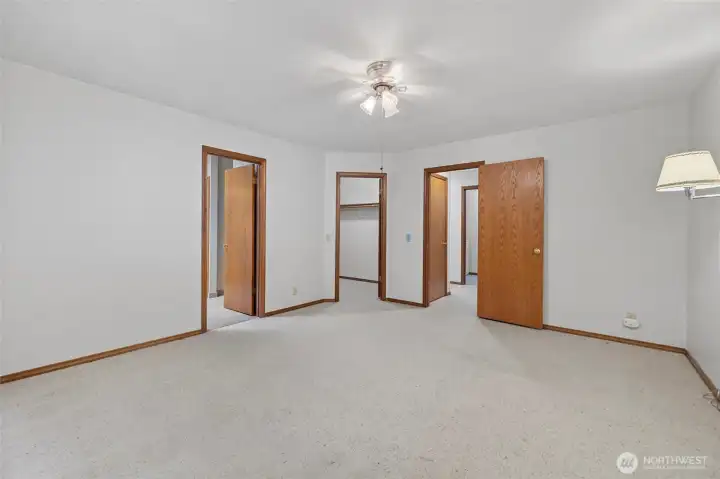 Spacious primary bedroom has 5 piece ensuite and large walk - in closet.