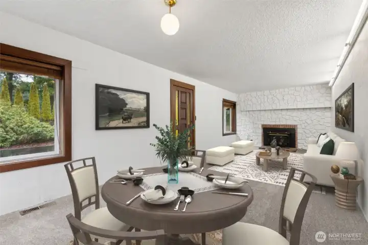 Living Room shot from the opposite angle w/ shot of breakfast nook virtually staged.