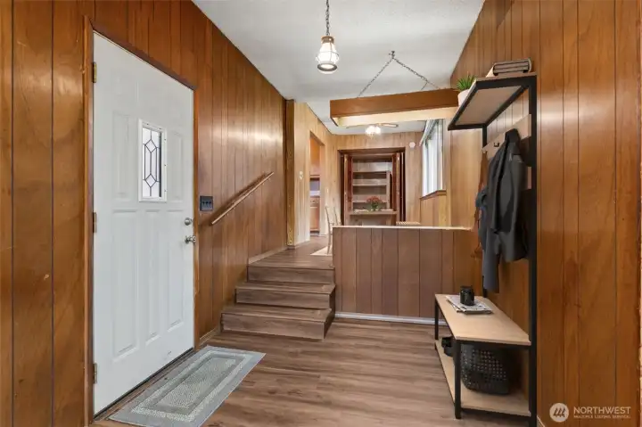 Perfect little mud room/back pack area where you will enter the home through after parking your cars under the enclosed carport virtually staged.