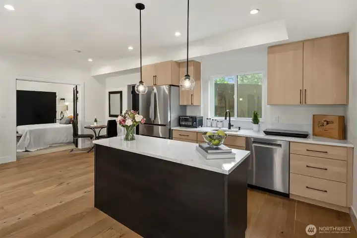 Spacious kitchen with full size refrigerator and dishwasher