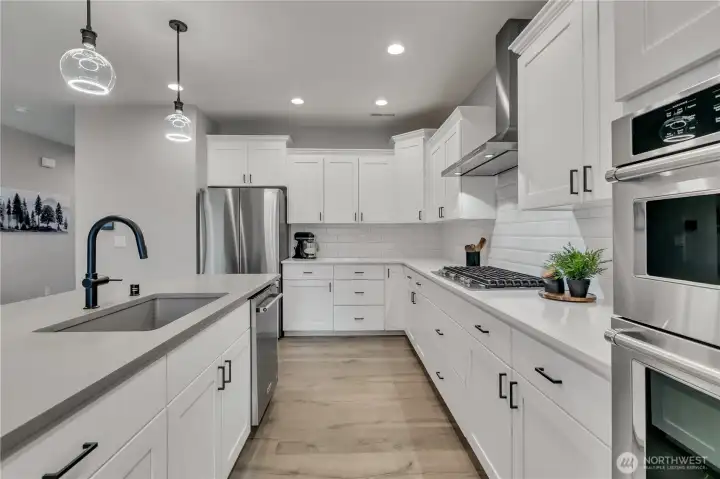 Custom door pulls throughout kitchen and bathrooms.