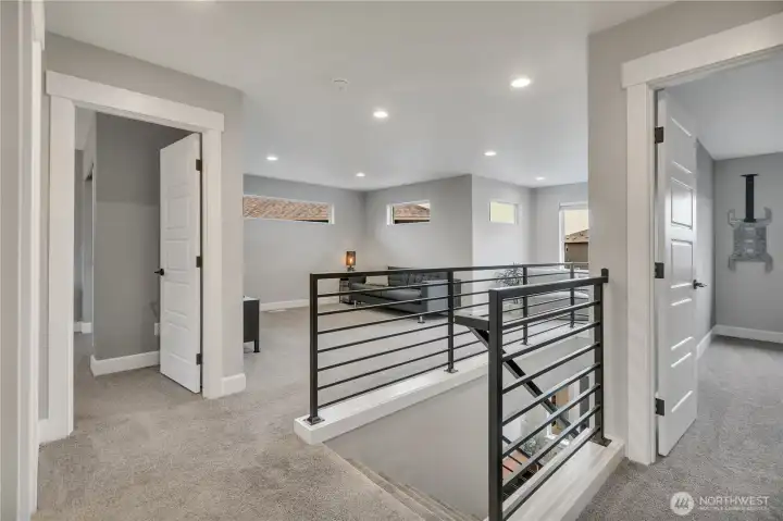 Large open loft with natural lighting and mountain views.
