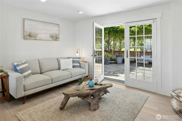 From living room to "media room" with frenchdoors to patio