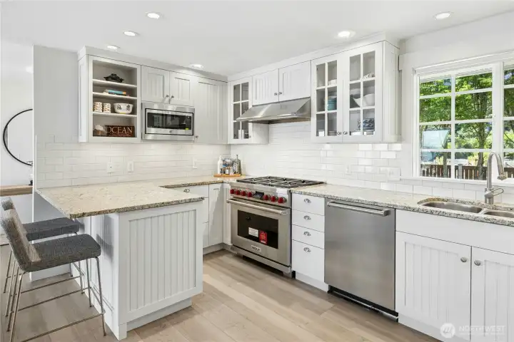Kitchen upgraded with Sub-Zero, Wolf duel- fuel cooktop and oven, Meile dishwasher & granite countertops