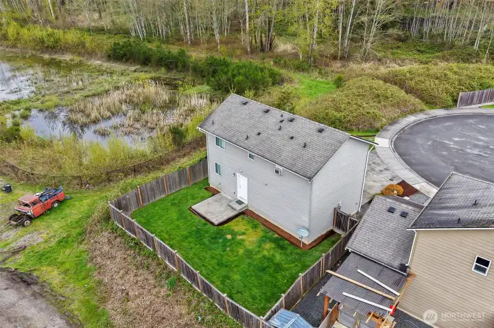 Aerial view shows the pond next door.  Endless opportunities for bird watching!