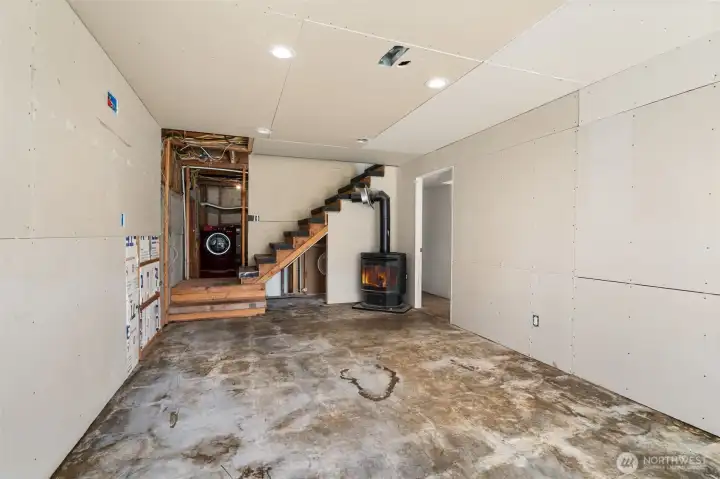 Lower level. Pellet stove is not connected, seller unsure if it works
