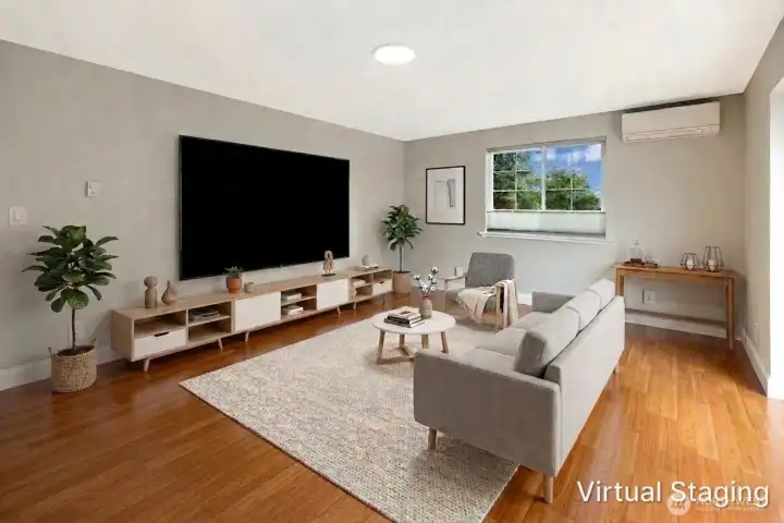 Large family room with virtual staging to show potential.
