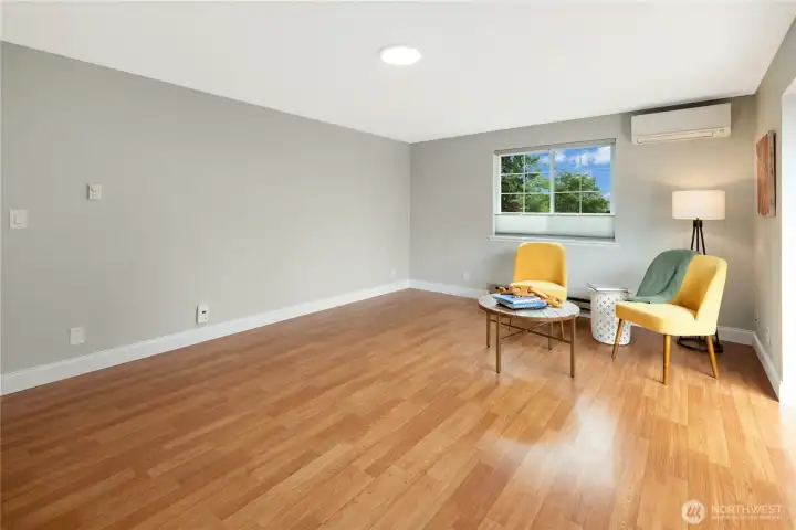 Large family room (18' x 13.5') is light and bright with slider access to the deck and back yard.