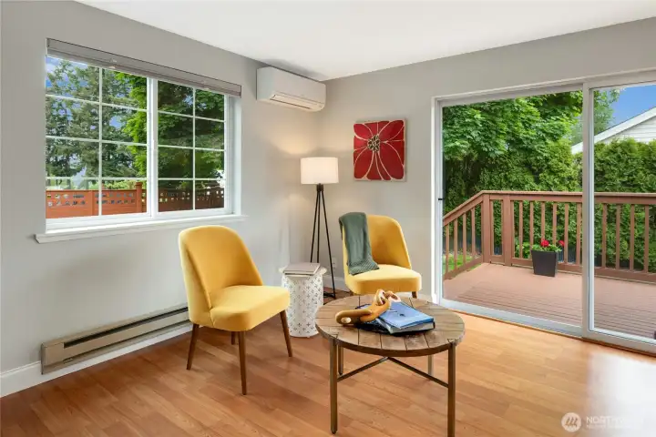 Mini-split heat pump offer energy efficient heat and A/C. Baseboard heaters still work, but are rarely used. Slider opens to deck and back yard