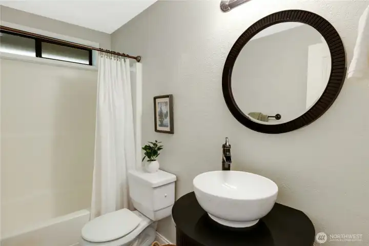 Updated Hallway bathroom with tub/shower.