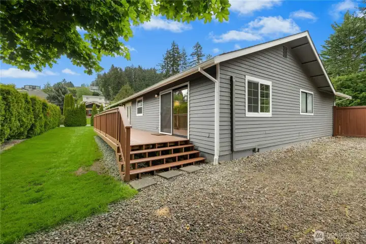 Deck stairs lead to huge gravel RV/boat storage area…