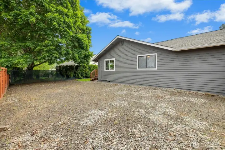 Expansive RV parking area is 26' x 40' on the West side of the home. Offering plenty of space for RV, Boat or possible home expansion with views.