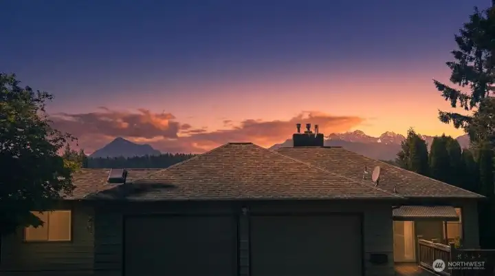 Sunset over Liberty Bay and the Olympic Mountains from this in-town home
