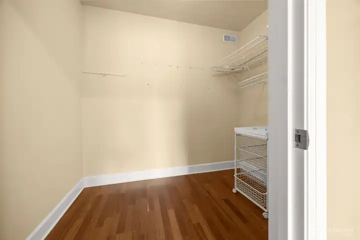 Primary bedroom walk-in closet.
