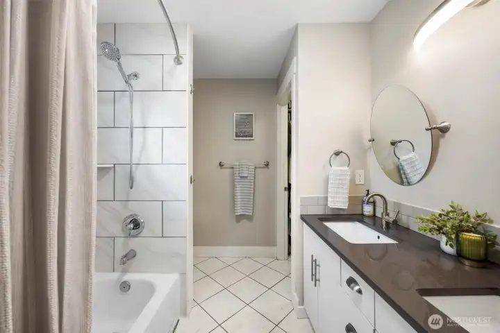 beautifully updated 4-piece ensuite with modern tile & quartz finishes, along with a spacious walk-in closet.