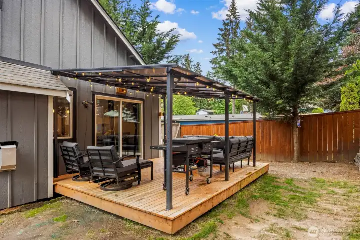 Newly built covered outdoor porch, ideal for year-round indoor/outdoor living and entertaining.