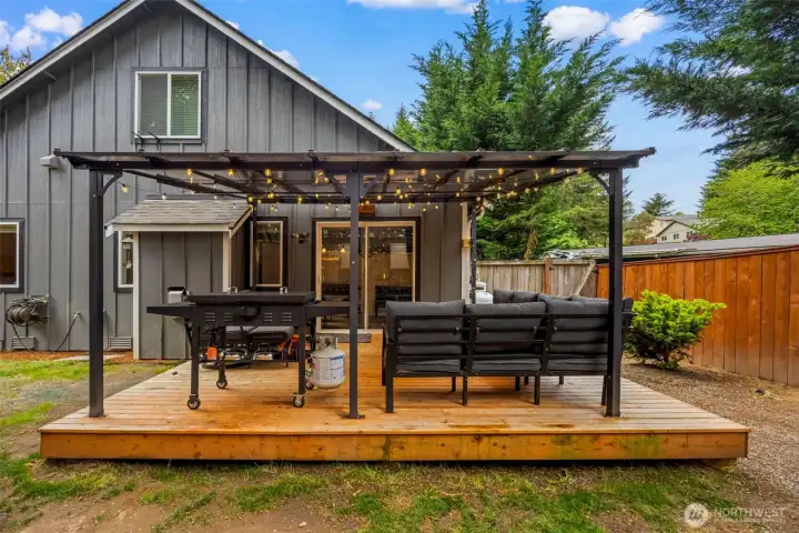 Newly built covered outdoor porch, ideal for year-round indoor/outdoor living and entertaining.