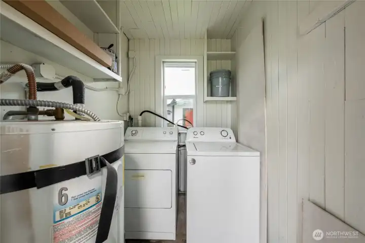 6146 Dedicated laundry and utility room with extra storage.