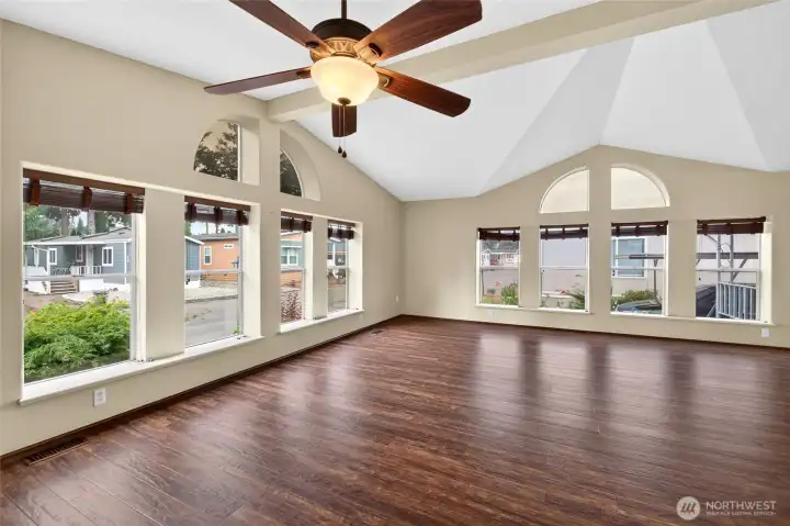 Large, open living room with easy-care laminate flooring.