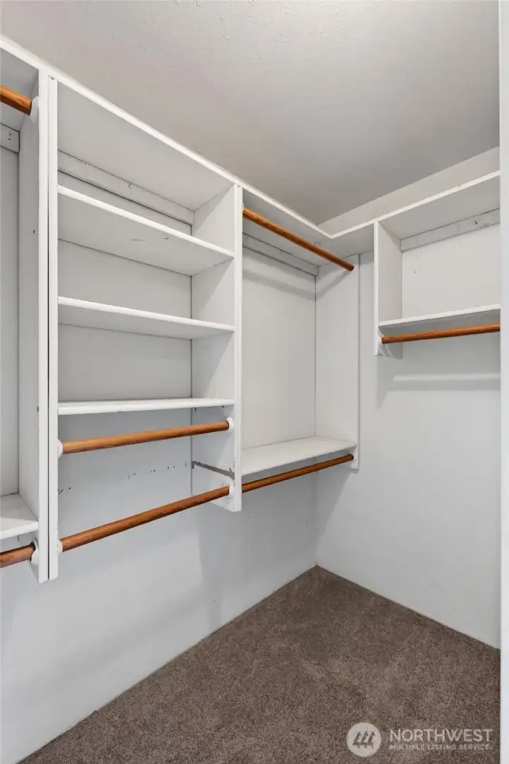 Primary bedroom walk-in closet.