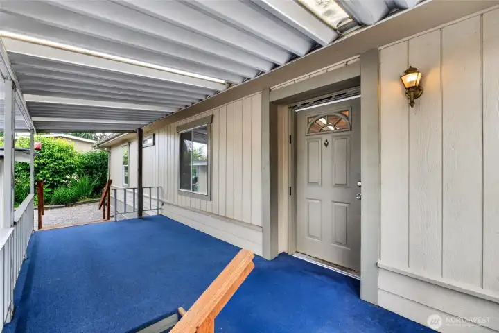 Carport parking and the covered entry porch conveniently keeps you dry.