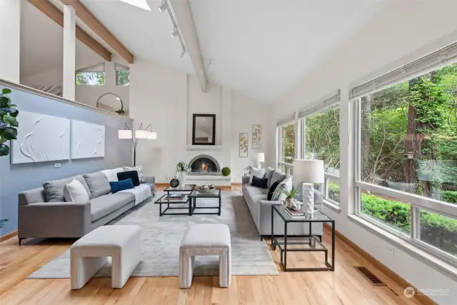 Huge living room with fireplace and many windows