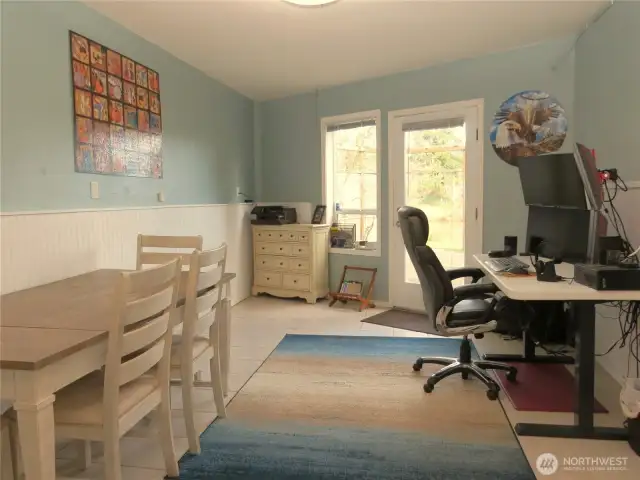 THE LOWER LEVEL ROOM IS BEING USED AS A HOME OFFICE, BUT IT HAS A GREAT VIEW OF THE PATIO GARDEN AND WATERFRONT!