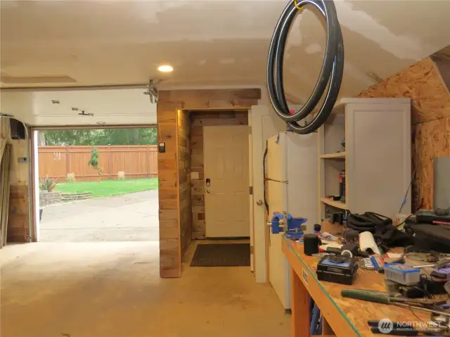 INSIDE THE GARAGE IS ALSO A WORK BENCH  AND ROOM FOR ANOTHER REFRIGERATOR!