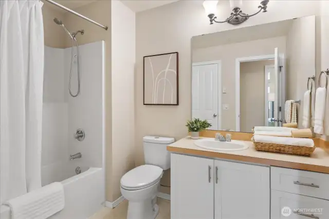 Plenty of space in the bathroom with access from both the primary bedroom and hall.