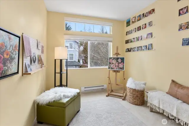 2nd bedroom has high windows and loads of light.  Currently utilized as an artist studio.