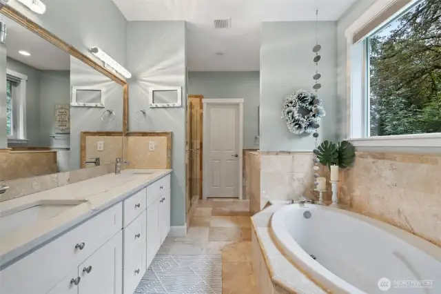 Deep soaking tub, full shower and dual sinks.  Walk-in closet in just beyond.