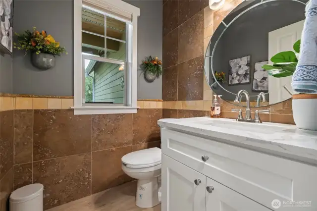A powder room is just inside the front entry for guests to use.