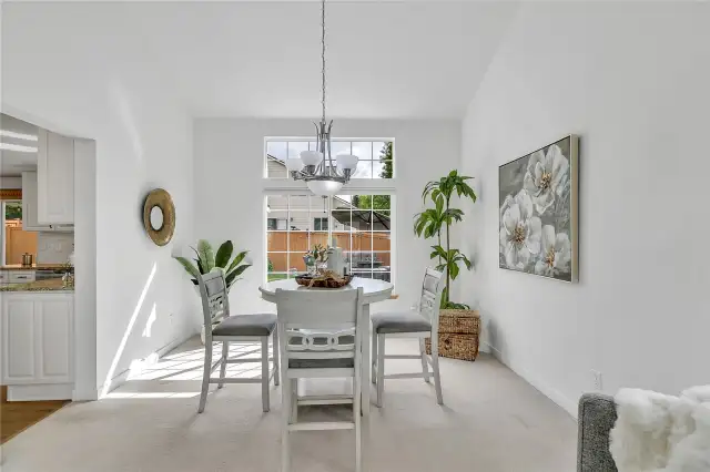 The dining room is perfectly positioned next to the kitchen, making mealtime effortless and gatherings seamless.