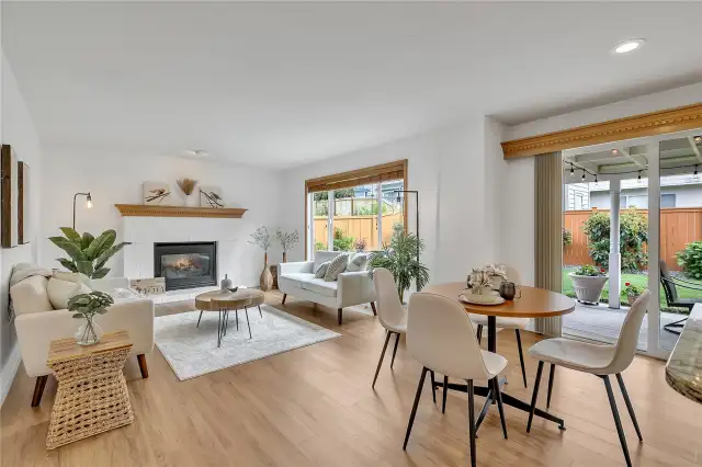 The open-concept kitchen seamlessly flows into the inviting family room, creating a warm and connected space. Anchored by a cozy gas fireplace, it's perfect for both everyday living and entertaining.