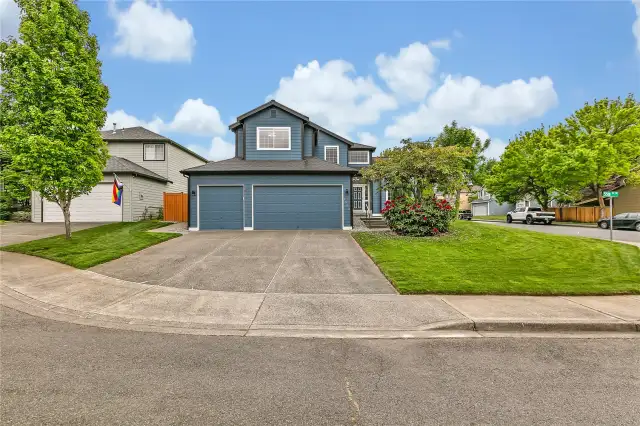 Plenty of parking with a spacious 3-car garage and an extra-wide driveway, offering convenience and ample space for multiple vehicles.
