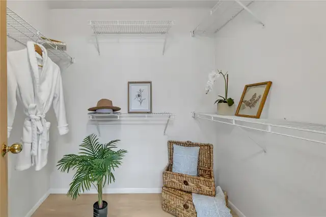 The spacious walk-in closet offers ample storage and organization.