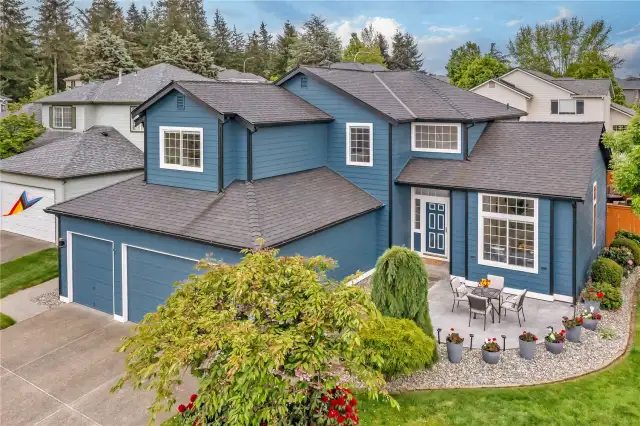 The beautifully crafted stamped concrete patio offers the perfect space to unwind in the afternoon while enjoying friendly gatherings with neighbors in a welcoming setting.
