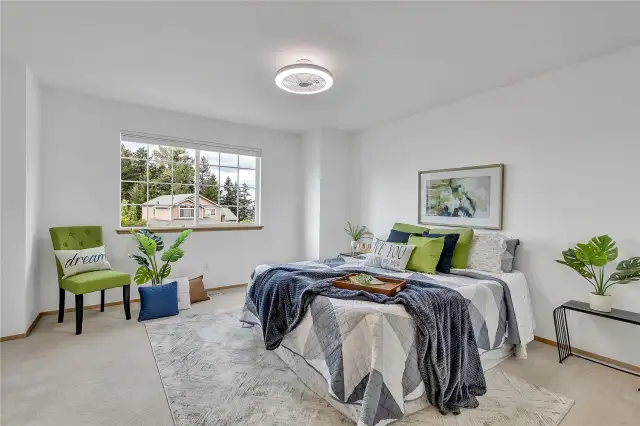 The fabulous third upstairs bedroom offers impressive versatility—spacious enough to double as a bonus room, perfect for work, play, or relaxation. Enhanced by a modern LED fan light, it provides comfort and style in one bright, inviting space.