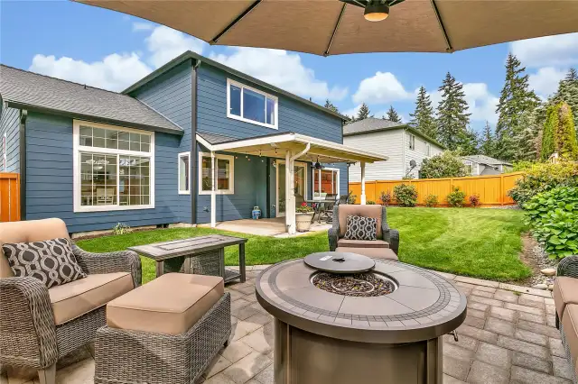 The spacious 14x14 backyard paver patio offers the perfect outdoor retreat, complete with all included outdoor furniture—and yes, that even includes the propane fire pit! It's a ready-to-enjoy space for cozy evenings and lively gatherings.