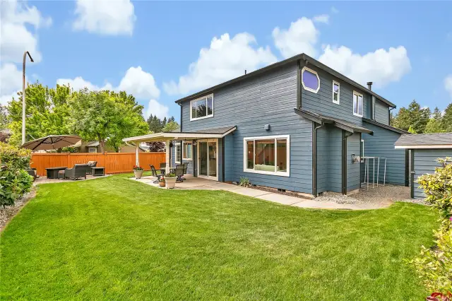 To the right, an 8x8 ft storage shed provides additional space for tools, equipment, and seasonal storage. The Rainbird seven-zone sprinkler system—complete with a Rachio smart controller—ensures the entire front and backyard stays lush and green all year round with effortless watering.