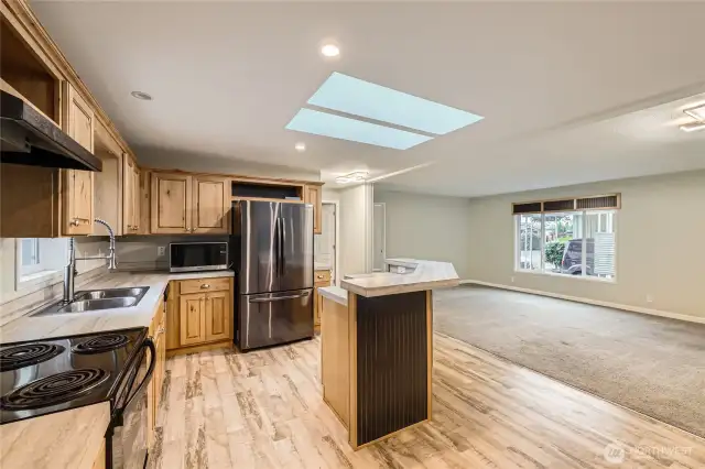 LVT laminate floors, plus carpet, skylight, two fridges.