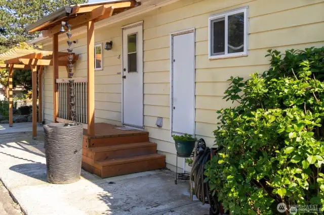 Side of home with additional entrance
