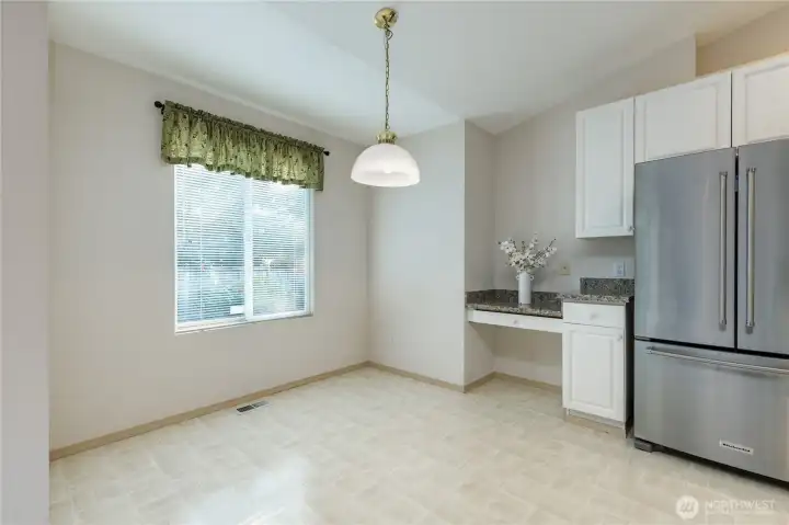 Breakfast nook includes a built-in desk. Refrigerator is only 1.5 years old!
