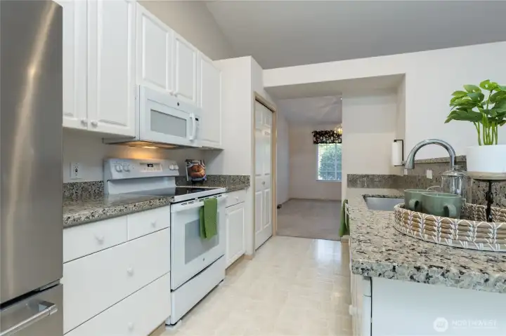 Beautiful granite counters in this updated kitchen