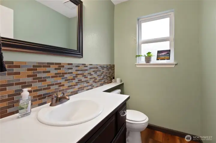 Lovely half bath. Full back splash tile is a plus!