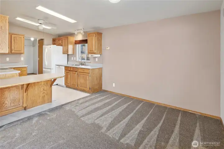 Spacious dining room looking into the kitchen