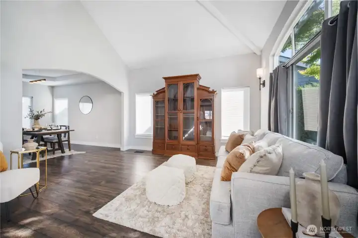 Formal Grand Entry with vaulted ceiling opens into living room filled with light. You will notice plenty of windows that fill the entire home with light.