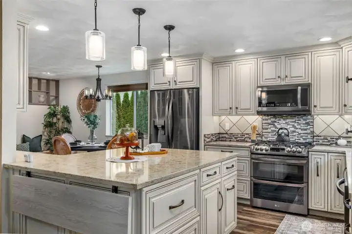 Fully updated kitchen, dining & living rooms in 2022. Thoughtful detail at every turn... the flip-up counter extension adds extra seating when you need it and neatly folds away when you don't.